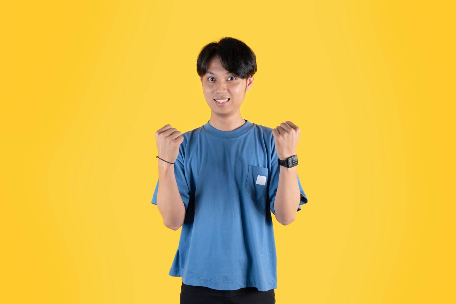 asian-man-with-clenched-fists-to-celebrates-succes-2025-04-28-03-44-00-utc-scaled.jpg